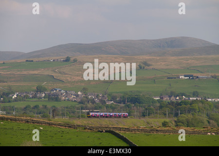 A class 350 First Transpennine Express EMU climbs past Greenholm on the ascent to Shap summit. 18th May 2014