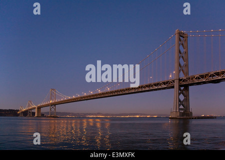 The BAY BRIDGE at night from THE EMBARCADERO - SAN FRANCISCO, CALIFORNIA Stock Photo