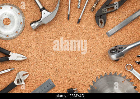Set of tools on cork panel background with copy space Stock Photo