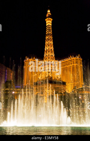 The evening FOUNTAIN SHOW at the BELLAGIO looking towards the PARIS HOTEL AND CASINO - LAS VEGAS, NEVADA Stock Photo