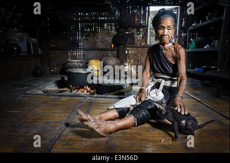 Portrait on an old Kayah woman with traditional attire in her house, Loikaw area, Myanmar, Asia Stock Photo