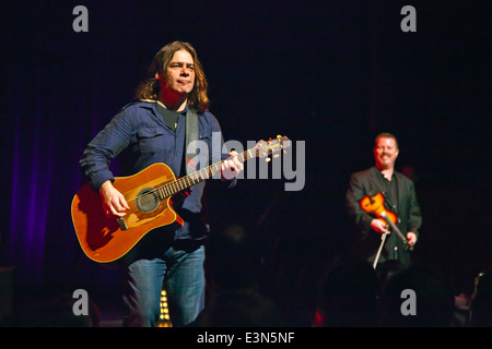 Alan Doyle plays guitar for GREAT BIG SEA. a singing group from Canada, preforming at the SUNSET CENTER - CARMEL, CALIFOR Stock Photo