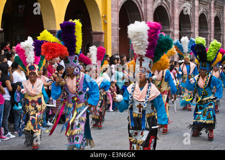 INDIGENOUS DANCE TROUPES from all over MEXICO parade through the streets during  Independence Day in SAN MIGUEL DE ALLENDE Stock Photo