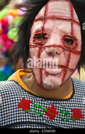 MASKED participant in the annual INDEPENDENCE DAY PARADE held on September 16th each year - SAN MIGUEL DE ALLENDE, MEXICO Stock Photo