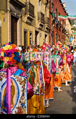 INDIGENOUS DANCE TROUPES from all over MEXICO parade through the streets during  Independence Day in SAN MIGUEL DE ALLENDE Stock Photo