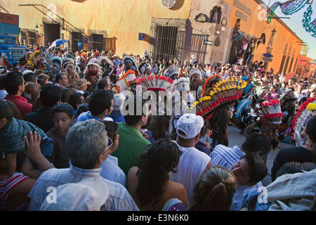 INDIGENOUS DANCE TROUPES from all over MEXICO parade through the streets during  Independence Day in SAN MIGUEL DE ALLENDE Stock Photo