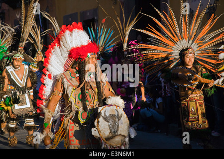INDIGENOUS DANCE TROUPES from all over MEXICO parade through the streets on independence day SAN MIGUEL DE ALLENDE Stock Photo