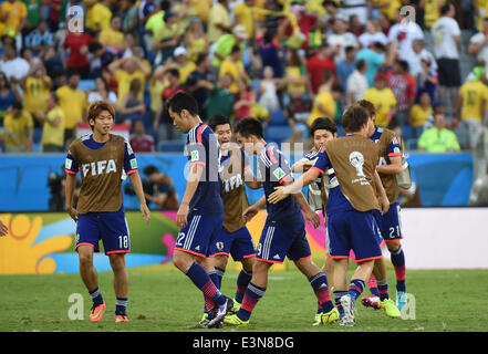 Cuiaba, Brazil. 24th June, 2014. Japan's players celebrate the goal during a Group C match between Japan and Colombia of 2014 FIFA World Cup at the Arena Pantanal Stadium in Cuiaba, Brazil, June 24, 2014. © Liu Dawei/Xinhua/Alamy Live News Stock Photo
