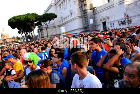 Rome, Italy. 24th June, 2014. Italy's supporters react after watching a Group D match between Italy and Uruguay of 2014 FIFA World Cup, at the Piazza Venezia square in Rome, capital of Italy, June 24, 2014. Italy lost the game by 0-1 on Tuesday. © Xu Nizhi/Xinhua/Alamy Live News Stock Photo