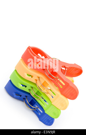 colorful clothespins stack up on white Stock Photo