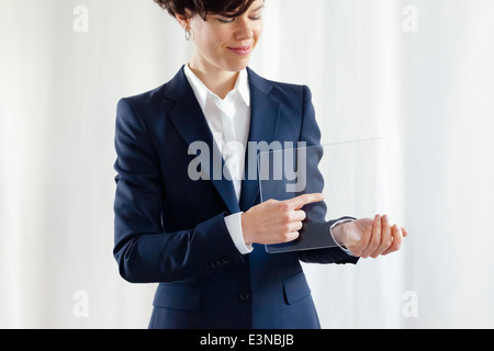 Confident Businesswoman Pointing On Modern Blank Electronic Digital Screen Stock Photo