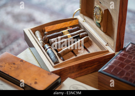High angle view of cigars in wooden box on table Stock Photo