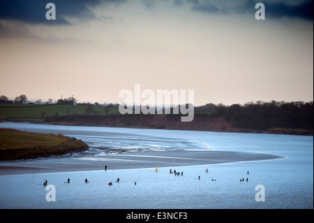 Surfers and canoeists waiting for the approaching Severn Bore tidal wave at Newnham-on-Severn, Gloucestershire UK 2014 Stock Photo