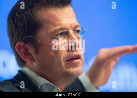 Berlin, Germany. 25th June, 2014. Former German Defence Minister Karl-Theodor zu Guttenberg speaks during the conference Transatlantic Dialogue in Berlin, Germany, 25 June 2014. In his speech zu Guttenberg spoke on the topic of 'Big Data zwischen Chaos und Ordnungspolitik' (Big data between chaos and policies of regulation). Photo: Hannibal Hanschke/dpa/Alamy Live News Stock Photo