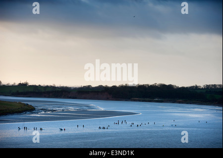 Surfers and canoeists waiting for the approaching Severn Bore tidal wave at Newnham-on-Severn, Gloucestershire UK 2014 Stock Photo