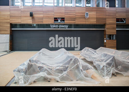 Berlin, Germany. 23rd June, 2014. Benches are covered with plastic at Berlin Brandenburg Airport in Berlin, Germany, 23 June 2014. After problems with the fire safety systems, the date for the opening of the airport is still no where in site. Photo: MICHAEL KAPPELER/dpa/Alamy Live News Stock Photo