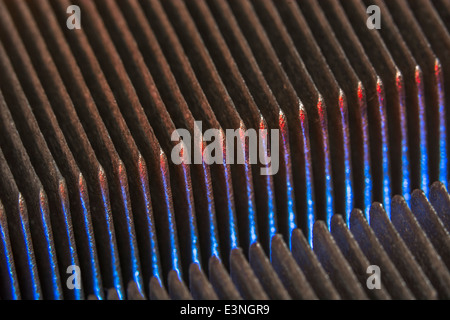 Macro-photo showing the cooling fins of a PC CPU cooling (fan) unit. For focus info see 'Description' section. Stock Photo