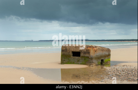 WORLD WAR II PILL BOX SINKING INTO THE SANDS ON FINDHORN BEACH MORAY COAST SCOTLAND Stock Photo