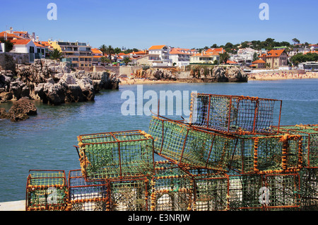 Fishing traps in a port and overall view of the beautiful touristic village of Cascais, Portugal. Stock Photo
