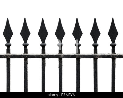 Old cast iron fence with spears isolated on white. Seamless fragment Stock Photo