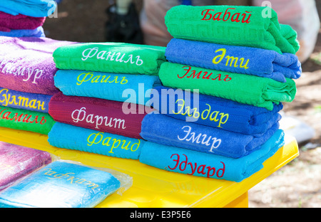 Stack of the multi colored towels with names on tatar language Stock Photo