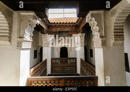 Intricately carved plasterwork on pillars and sconces on walls of the Museum of Marrakech, Morocco Stock Photo