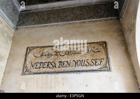 Sign for Medersa Ben Youssef University, the oldest museum in the workd, at the Museum of Marrakech, Morocco Stock Photo