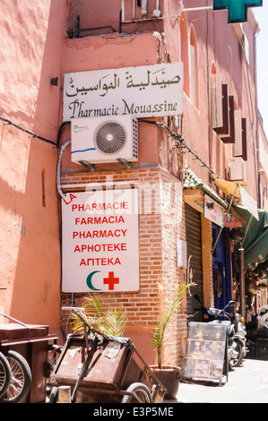 Sign saying 'Pharmacy, Pharmacie, Farmacia, Apteke' at a Chemist shop in Marrakech, Morocco Stock Photo