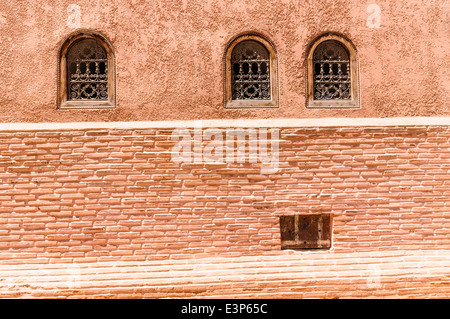 Ornately decorated wrought iron grills on windows of a building in Marrakech old town, Morocco Stock Photo