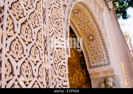 Fine plaster fretwork around the door entrance to Ryad Riad Zouina, old city, Marrakech, Morocco Stock Photo