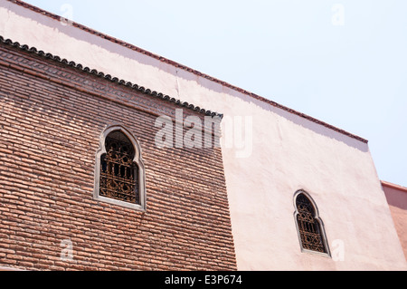 Windows on the upper floors of buildings in the old city of Marrakech, Morocco Stock Photo