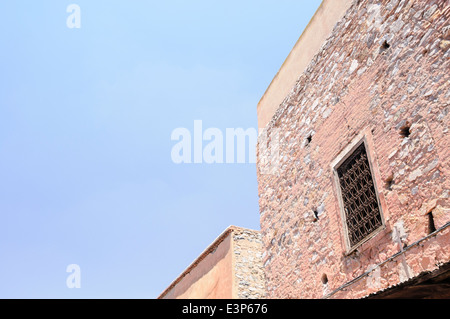 Windows on the upper floors of buildings in the old city of Marrakech, Morocco Stock Photo