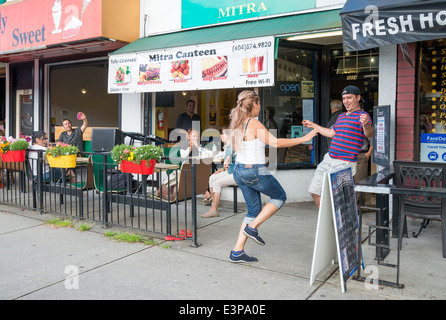 Couple dancing outside Mediterranean Restaurant . Stock Photo