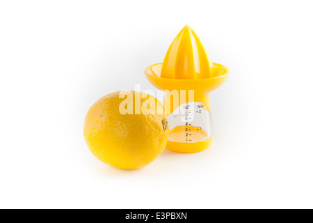 Lemon and Lemon juicer reamer on white background. cut out Stock Photo
