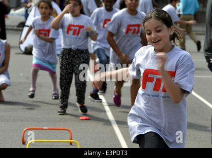 New York, USA. 25th June, 2014. Children attend the lanching ceremony of summer meals plan in New York, the United States, on June 25, 2014. New York City officials have announced that free summer meals for children during summer vacation. © Wang Lei/Xinhua/Alamy Live News Stock Photo