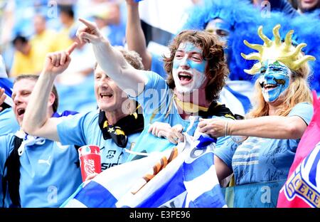 Natal, Brazil. 24th June, 2014. Uruguay's fans pose before a Group D match between Italy and Uruguay of 2014 FIFA World Cup at the Estadio das Dunas Stadium in Natal, Brazil, June 24, 2014. © Guo Yong/Xinhua/Alamy Live News Stock Photo