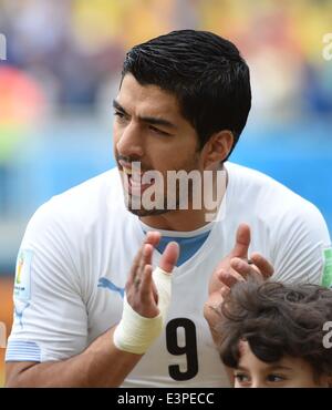 Natal, Brazil. 24th June, 2014. Uruguay's Luis Suarez applauds before a Group D match between Italy and Uruguay of 2014 FIFA World Cup at the Estadio das Dunas Stadium in Natal, Brazil, June 24, 2014. © Guo Yong/Xinhua/Alamy Live News Stock Photo