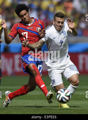 Belo Horizonte, Brazil. 24th June, 2014. Costa Rica's Yeltsin Tejeda (L) vies with England's Jack Wilshere during a Group D match between Costa Rica and England of 2014 FIFA World Cup at the Estadio Mineirao Stadium in Belo Horizonte, Brazil, on June 24, 2014. © Qi Heng/Xinhua/Alamy Live News Stock Photo