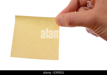 Hand holding a yellow sticky note Stock Photo