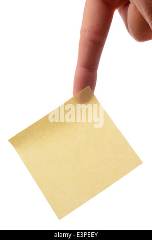 Hand holding a blank yellow sticky note in front of colorful notes with ...