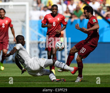 Brasilia, Brazil. 26th June, 2014. Portugal's Ruben Amorim (L) competes with Jonathan Mensah during a Group G match between Portugal and Ghana of 2014 FIFA World Cup at the Estadio Nacional Stadium in Brasilia, Brazil, June 26, 2014. Portugal won 2-1 over Ghana on Thursday. © Qi Heng/Xinhua/Alamy Live News Stock Photo