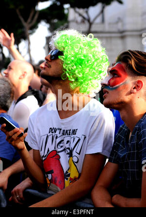 Rome, Italy. 24th June, 2014. Italy's supporters react while watching a Group D match between Italy and Uruguay of 2014 FIFA World Cup, at the Piazza Venezia square in Rome, capital of Italy, June 24, 2014. Italy lost the game by 0-1 on Tuesday. © Xu Nizhi/Xinhua/Alamy Live News Stock Photo