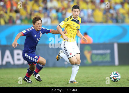 (140624) -- CUIABA, June 24, 2014 (Xinhua) -- Japan's Toshihiro Aoyama vies with Colombia's James Rodriguez during a Group C match between Japan and Colombia of 2014 FIFA World Cup at the Arena Pantanal Stadium in Cuiaba, Brazil, June 24, 2014. (Xinhua/Li Ming) Stock Photo