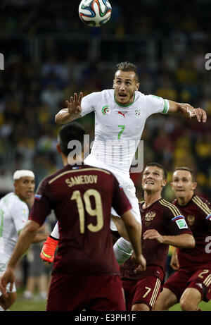 (140626) -- CURITIBA, June 26, 2014 (Xinhua) -- Algeria's Hassan Yebda (up) competes for a header during a Group H match between Algeria and Russia of 2014 FIFA World Cup at the Arena da Baixada Stadium in Curitiba, Brazil, June 26, 2014. The match ended in a 1-1 draw.Algeria enters Round of 16 after the Thursday match which ended in a 1-1 draw.(Xinhua/Liao Yujie) Stock Photo