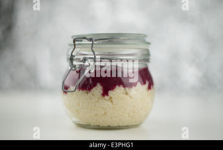 Rice pudding with cherry sauce in a bottling jar, 13 June 2014 in Hamburg. Stock Photo