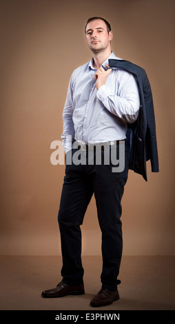 Businessman wearing suit in a relaxed position. Stock Photo