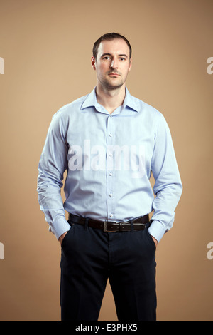 Man wearing business outfit standing relaxed. Stock Photo