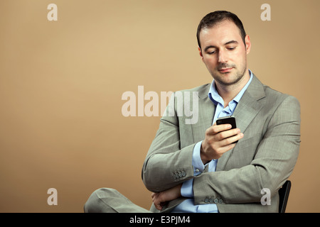Relaxed man wearing classic business outfit while is making a phone call. Stock Photo