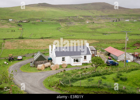 Small traditional croft farmhouse on farm in rural countryside valley. Fairy Glen, Uig, Isle of Skye, Scotland, UK, Britain Stock Photo