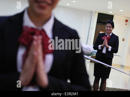 June 27, 2014 - West Jakarta, Jakarta, Indonesia - Cabin crews trainee at the Garuda Indonesia Training Centre. As the air travel is marked as the safest, the aim of the trainee is zero accident victim. The trainee is needed to get the certificates of IATA, a trade association representing and serving the airline industry world-wide. (Credit Image: © Afriadi Hikmal/ZUMA Wire/ZUMAPRESS.com) Stock Photo